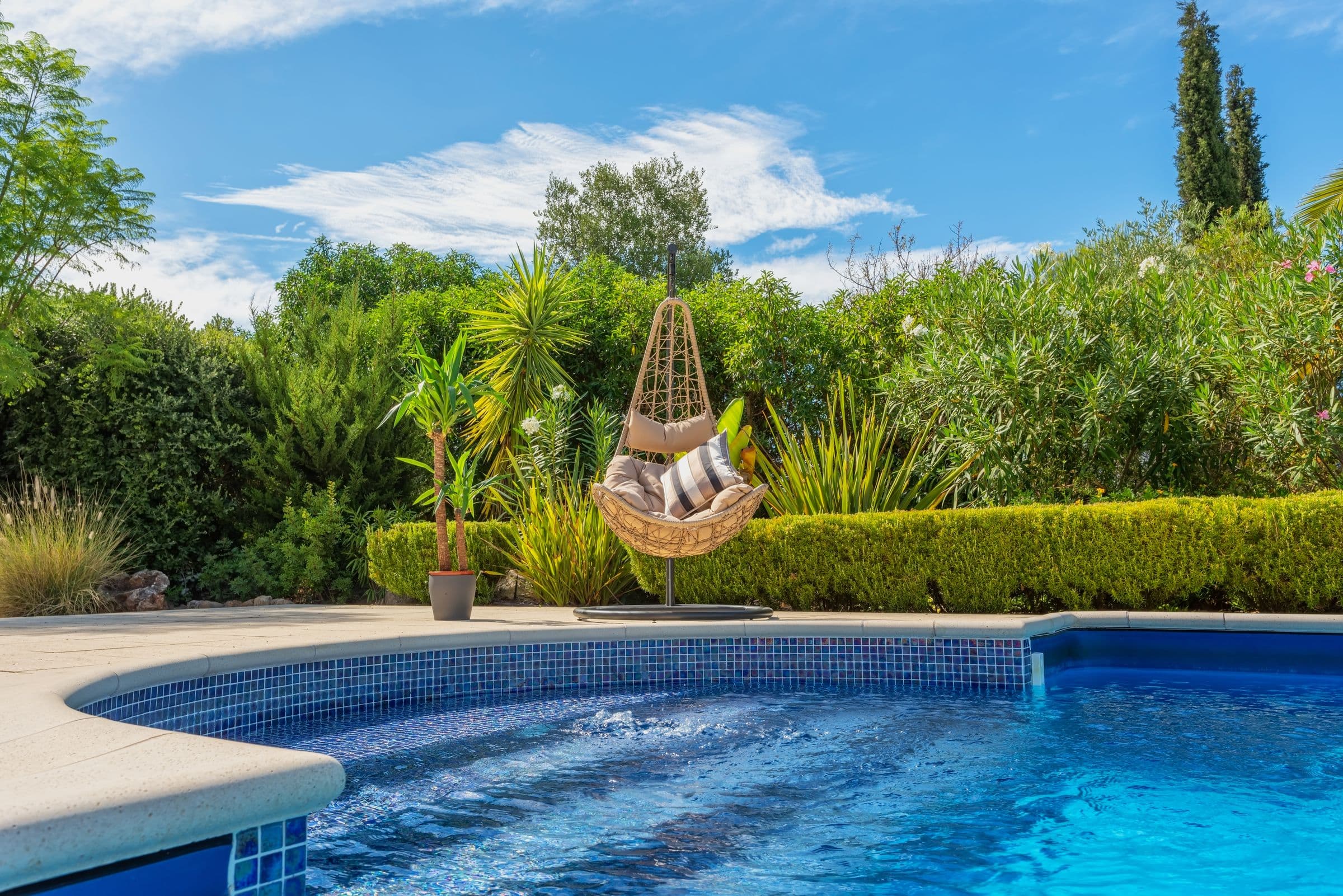 A villa garden with a private pool