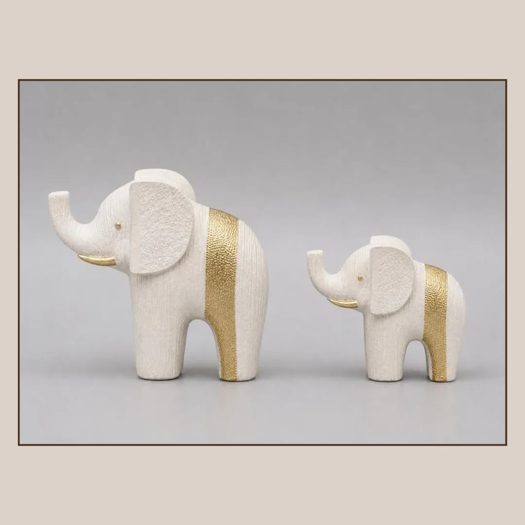 Resin elephant figurine, stone and gold, 14 x 5 x 14 cm