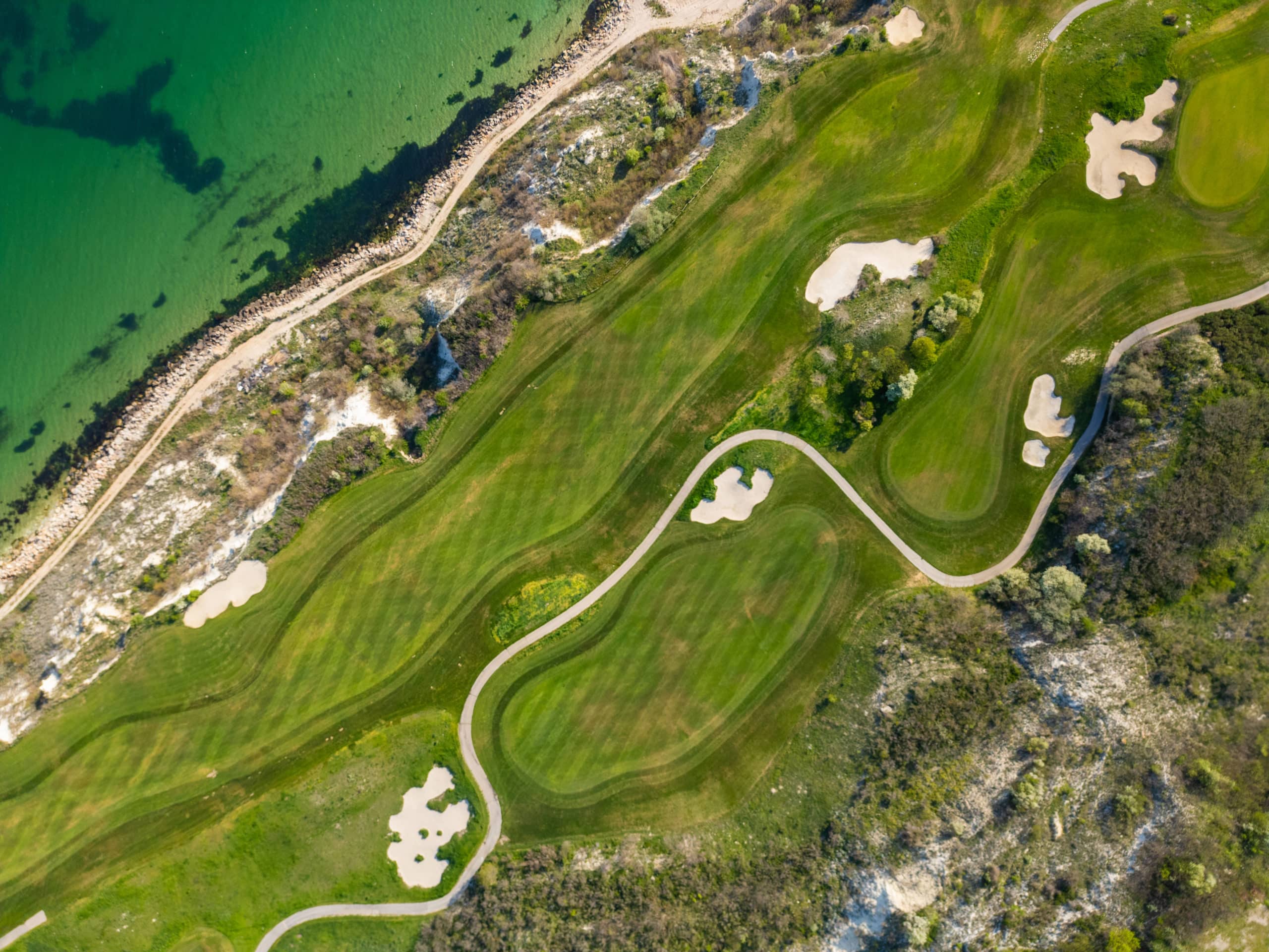 Aerial View of Golf Course Adjacent to Sea
